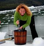 With an ice-pick, Cherie breaks apart the glacial ice and puts it into the traditional ice-cream maker.