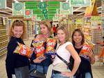 Four big Flirts.  Cherie, Carter, Kristi and Renee with bags of Flirts, a typical South African snack.