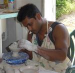 A local artist makes pottery.