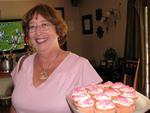 Linda arrives with more pink ribbon cupcakes.