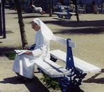 Just what you want to see when you are so hung-over you can barely stand...a nun innocently reading on a bench.