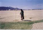Yes, even in the middle of Black Rock Desert you can golf.  Here is a guy attending to the greens.  (Rather, he is painting the green.)