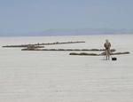 The artist and his arrow of mud people.