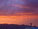 The desert sunset is worth a climb on top of your vehicle.