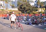 Kevin leaving hte "transition" area.  Look at all those bikes, whose owners haven't even finished the swim yet!