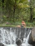 Cherie on top of a waterfall.