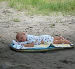 Look what the tide washed in, a baby on a boogie board!