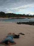 Greg resting after our long walk.  The sand on this beach was composed entirely of crushed sea shells.