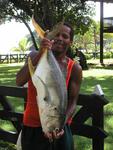 A local fisherman holding up lunch!