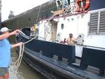 Rennie throwing a line to the tug boat we tied Scirocco up to.