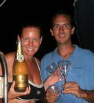 After a successful crossing, Greg and Cherie pop the champagne and everyone celebrates!