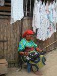 A native woman sewing a "mola."