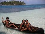 The Kuna kids entertaining themselves in a hand-dug canoe.