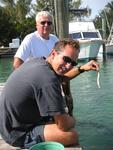 Cheap entertainment.  You buy a bucket of fish at "Robbie´s" for $2 then you feed tarpon all afternoon.  (Greg and his dad John.)