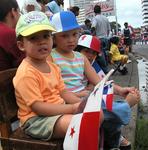 Darling Panamanian girls watching a parade.