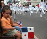 The young tot watches me, more than the parade.