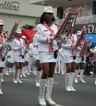 Girls making twanging sounds with weird instruments. 