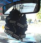 A cab driver's way of acknowledging Christmas...more pine tree air fresheners.
