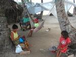 A Kuna family relaxing on Nuinudup, the San Blas Islands.