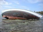 Did someone make a wrong turn somewhere?  (The real story is a Swiss guy tried to come into the anchorage at night, he cut the curve a little too close and now the boat was history.)