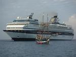 Scirocco anchored next to a pirate ship and a cruise ship.