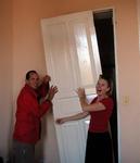 Greg and Kristi tearing a house down!  (They are always getting into trouble!)