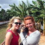 Cherie and Kristi cuddle the croc.