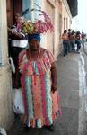 This lady has an interesting marketing technique.  She walks up and down the street screaming until someone buys a sweet from her basket.