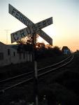 The railroad crossing at sunset.