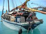 A boat loaded with goods ready to sail to Haiti.  (The guy told me he wanted to fit a few more things on board, like another car or two.)