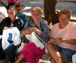 Women sewing in the park.