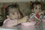 Little girl eats her ice-cream.