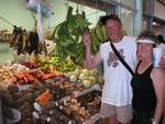 Dad examines the bananas and finds them a little too green. 