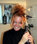 Cherie's natural curls get a new twist with a curling iron.