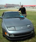 Greg's Nissan stands out in a sea of Porsches.