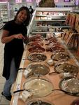 Renee at the spice counter at the grocery store.