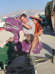 Jason and Andy ride the purple dino.