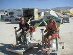 Cherie and Greg on the Fart-Kart and the Gotta-Go-Kart ready to (N)ass-car race.