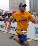 Greg rushes the finish line at full speed for a spectacular finish to his first triathlon!