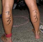 Each runner is marked with their age on the back of their calves.