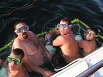 A group of guys are so excited to see the sharks, they jump in without wetsuits!