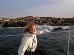 Cherie poses in front of seal island, which we pass on the way back to shore.