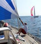 Greg adjusts the staysail as we try to catch Shaka in the distance.