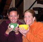 Back at the cabin, Cherie and Jean warm up with coffee and Baileys.