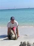 Greg builds a sand-castle on shore.