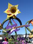 Let's be serious here.  That guitar is way too complicated for a dandelion to play.