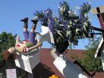 Roto-Rooter Plumbers brought "Troubled Waters" to the parade.  The spinning toilet is made of crushed and powdered white rice.  The splashing water is composed of blue and white iris and gypsophilia.