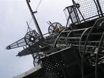 Cherie climbs the mast.  Notice the poofy red-hair sticking out of the metal.  *Photo by Greg.