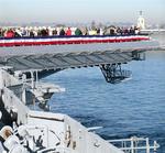 Everyone gathers on the flight deck to watch the Midway twist around San Diego Bay.