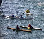 Kayakers paddled over to watch the Midway pull into its new home on the south side of Navy Pier 11A.